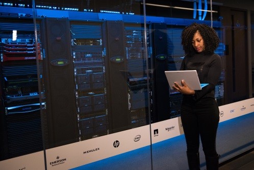 girl standing while on computer